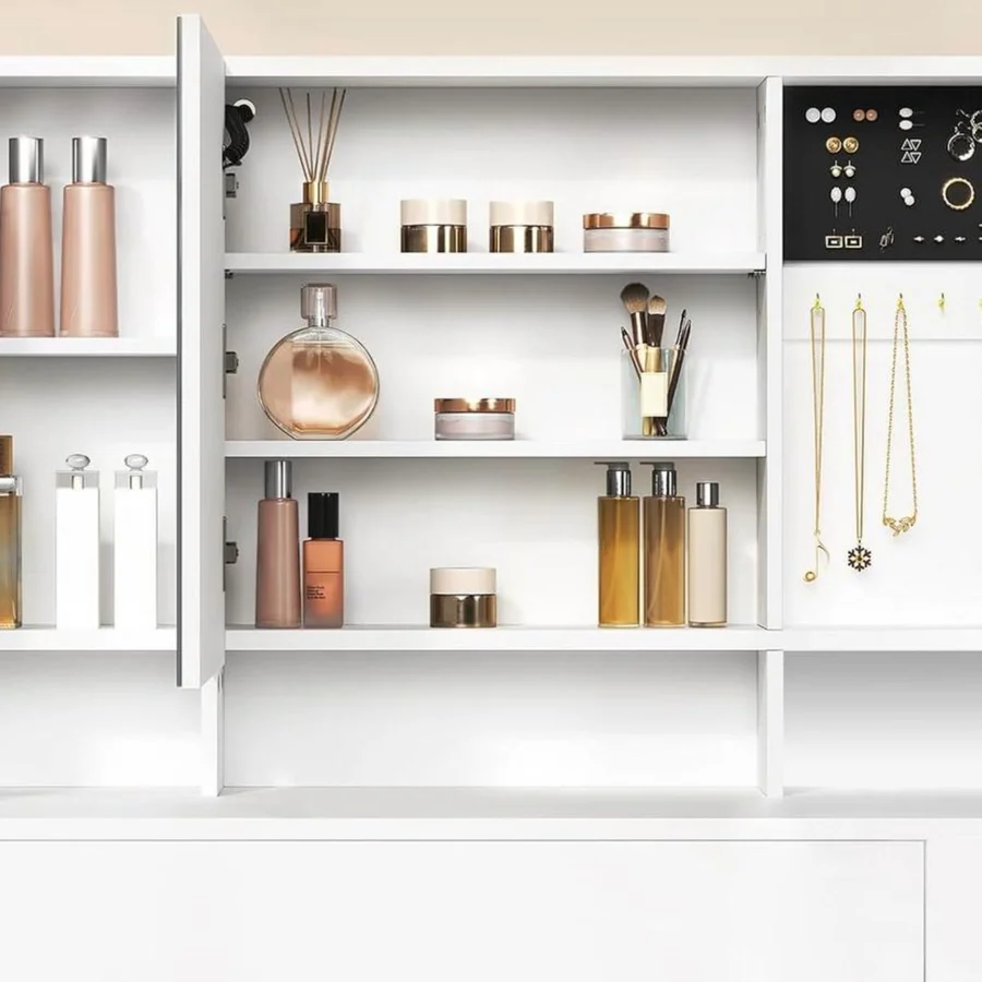The mirror panels open on the cabinets: bottles, earrings and necklaces