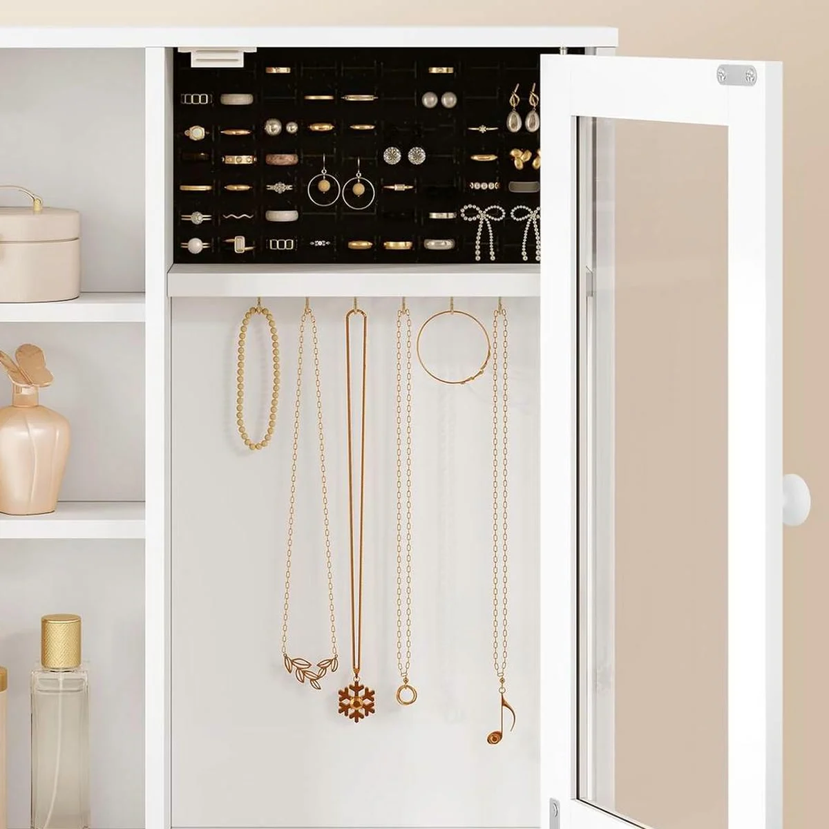 The jewellery box open: rings and earrings at the top, necklaces on 6 gold hooks