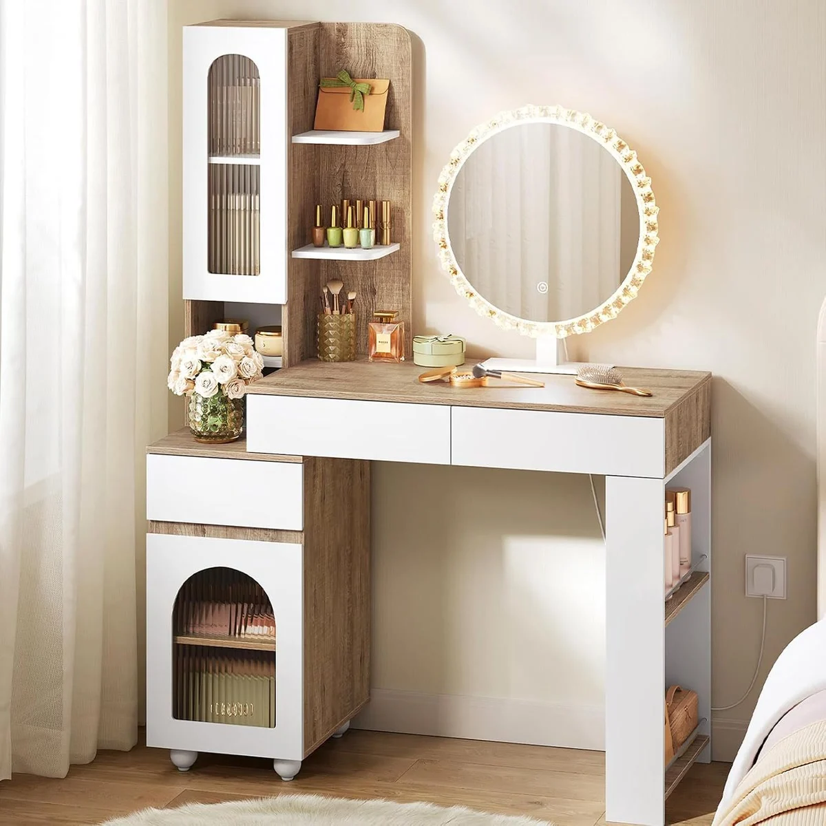 Light oak and white dressing table in a bedroom, with the round mirror lit