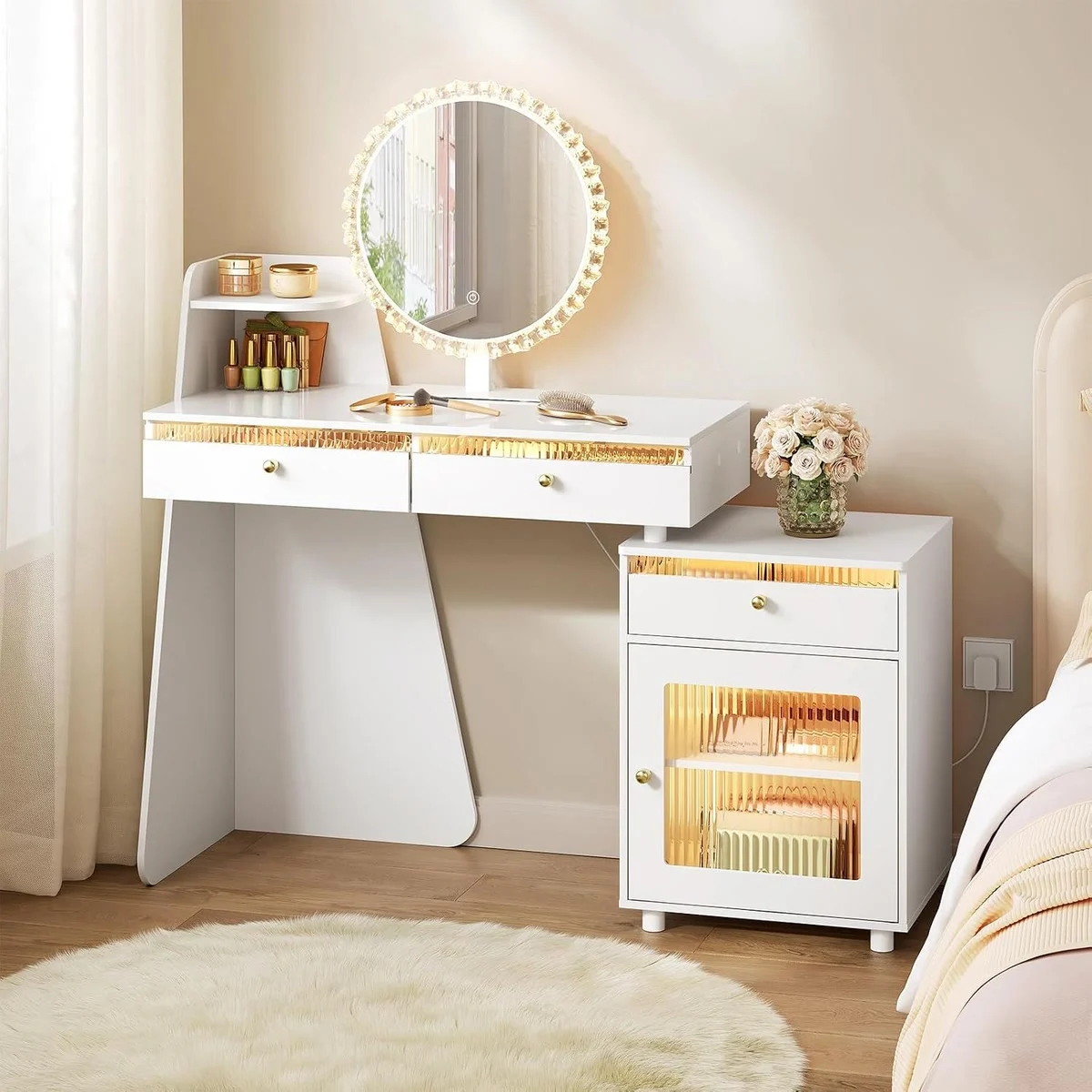 White dressing table in a bedroom, with the round mirror and the cabinet lit