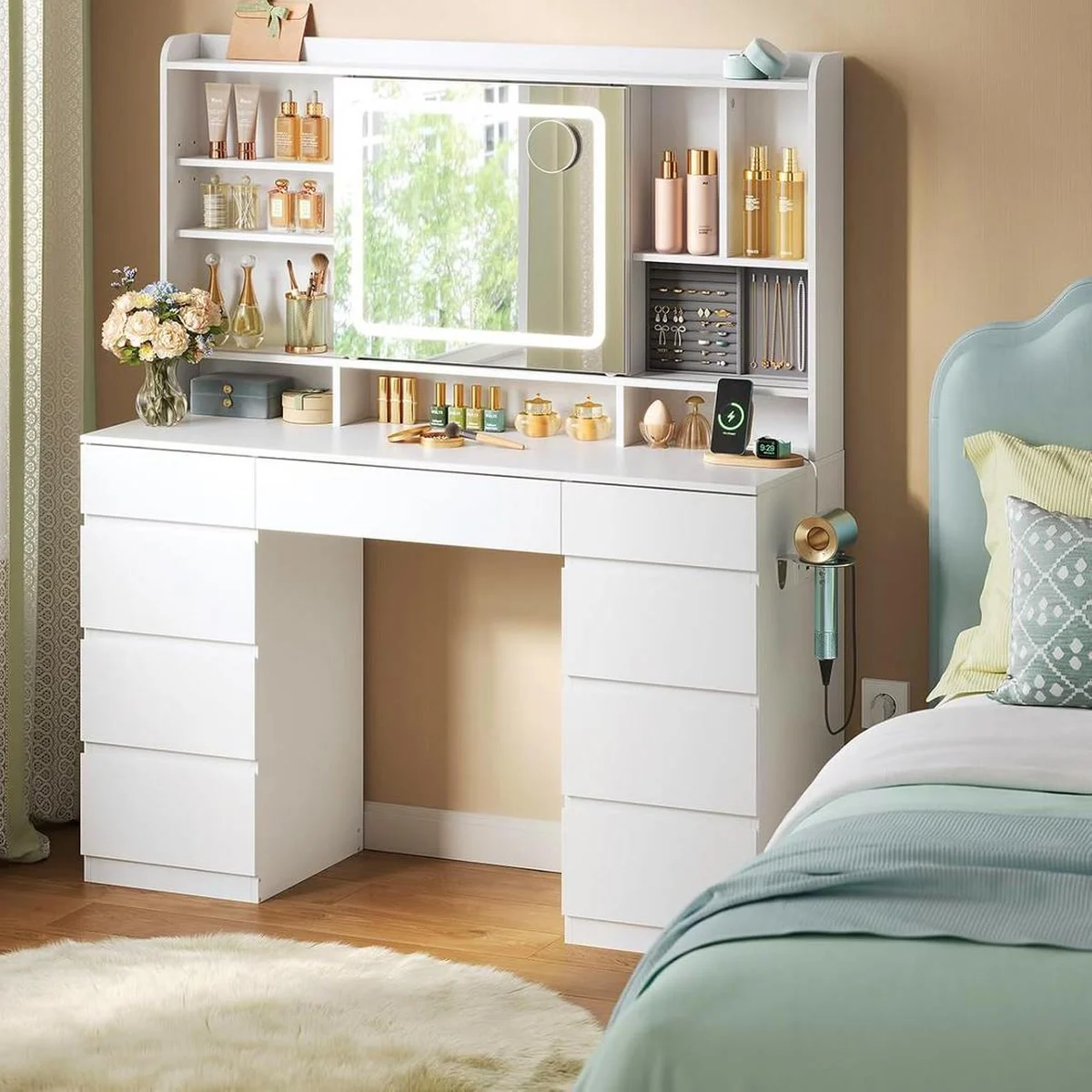 White 107 cm dressing table in a bedroom, LED mirror lit between the shelves