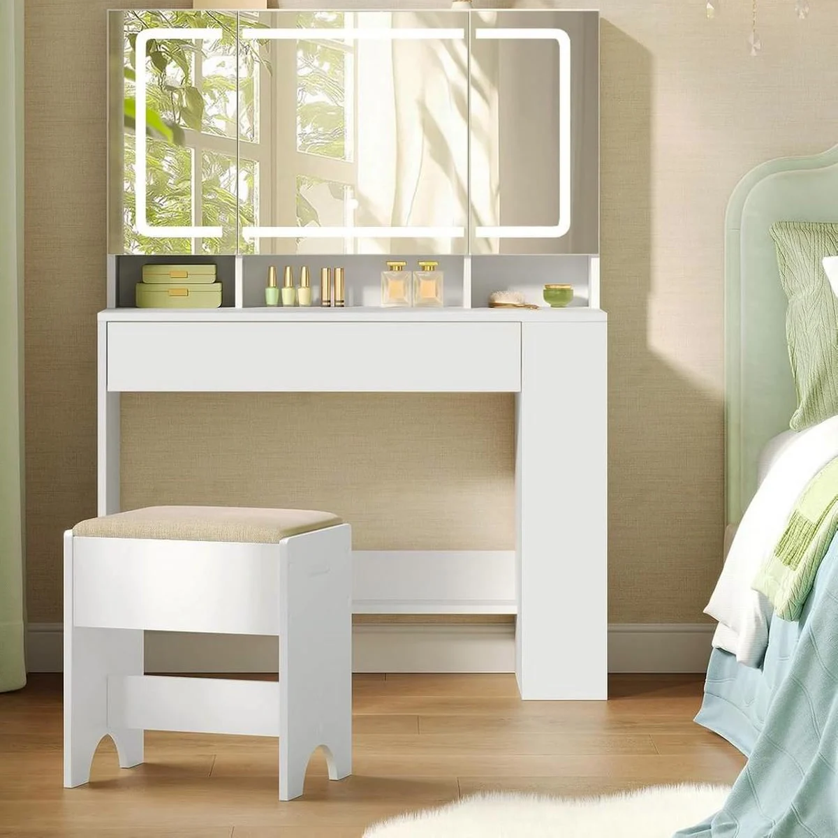The dressing table in a bedroom, tri-fold mirror lit