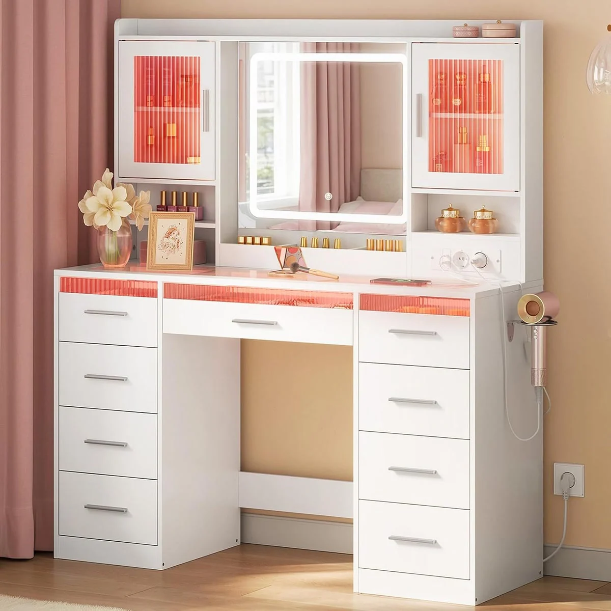 White 107 cm dressing table in a bedroom, with the LED mirror and cupboards lit