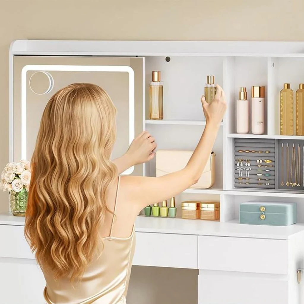 The mirror slid to one side, a woman takes a bottle from the shelves hidden behind it
