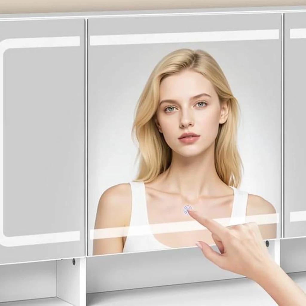A woman switches on the mirror with a tap