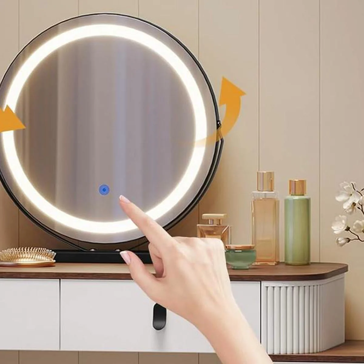 The round mirror lit up, adjusted with a touch