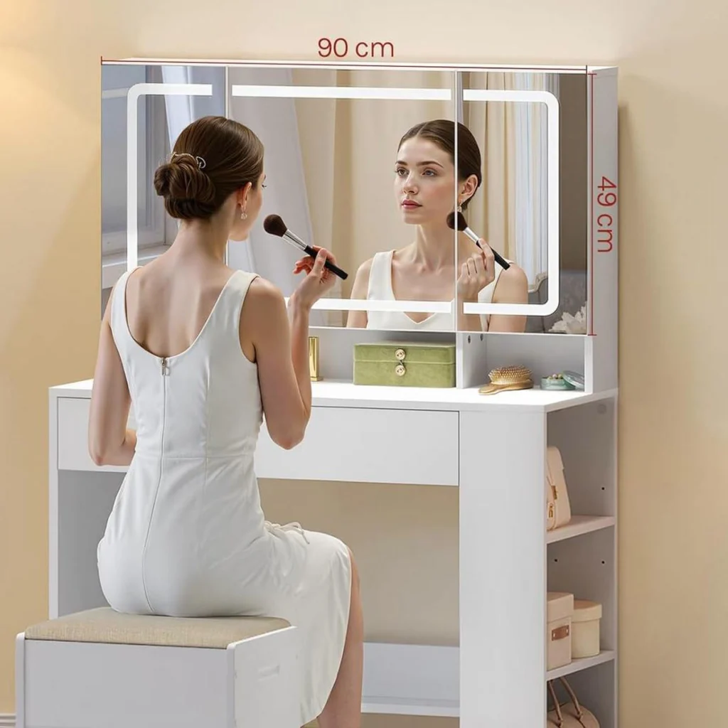 A woman doing her make-up in front of the 90 cm tri-fold mirror