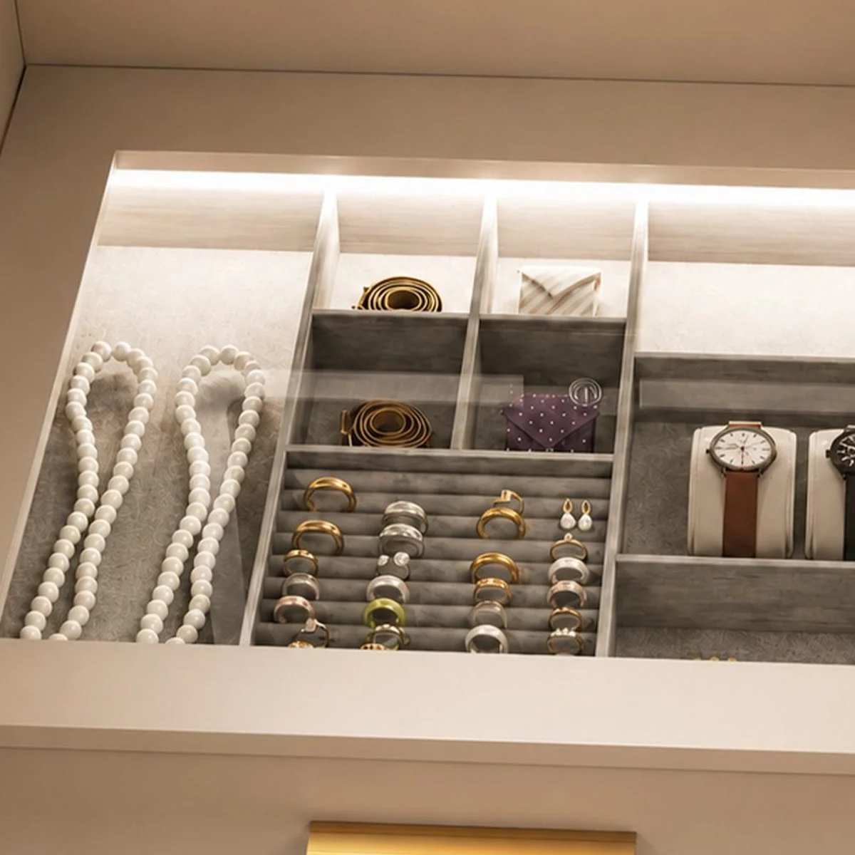Rings, necklaces and watches stored under the lit glass top