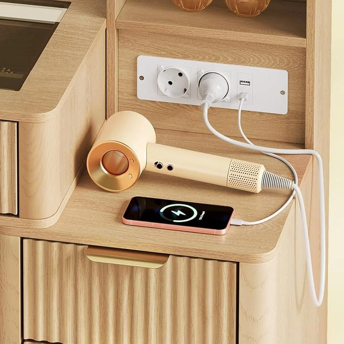 The 2 sockets and the USB and USB-C ports, with a hair dryer and a phone plugged in
