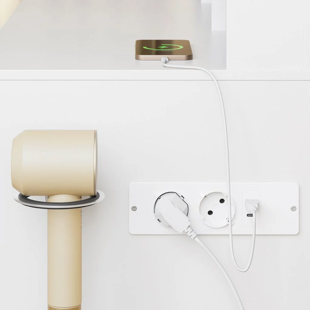 The power strip on the side and the hairdryer holder