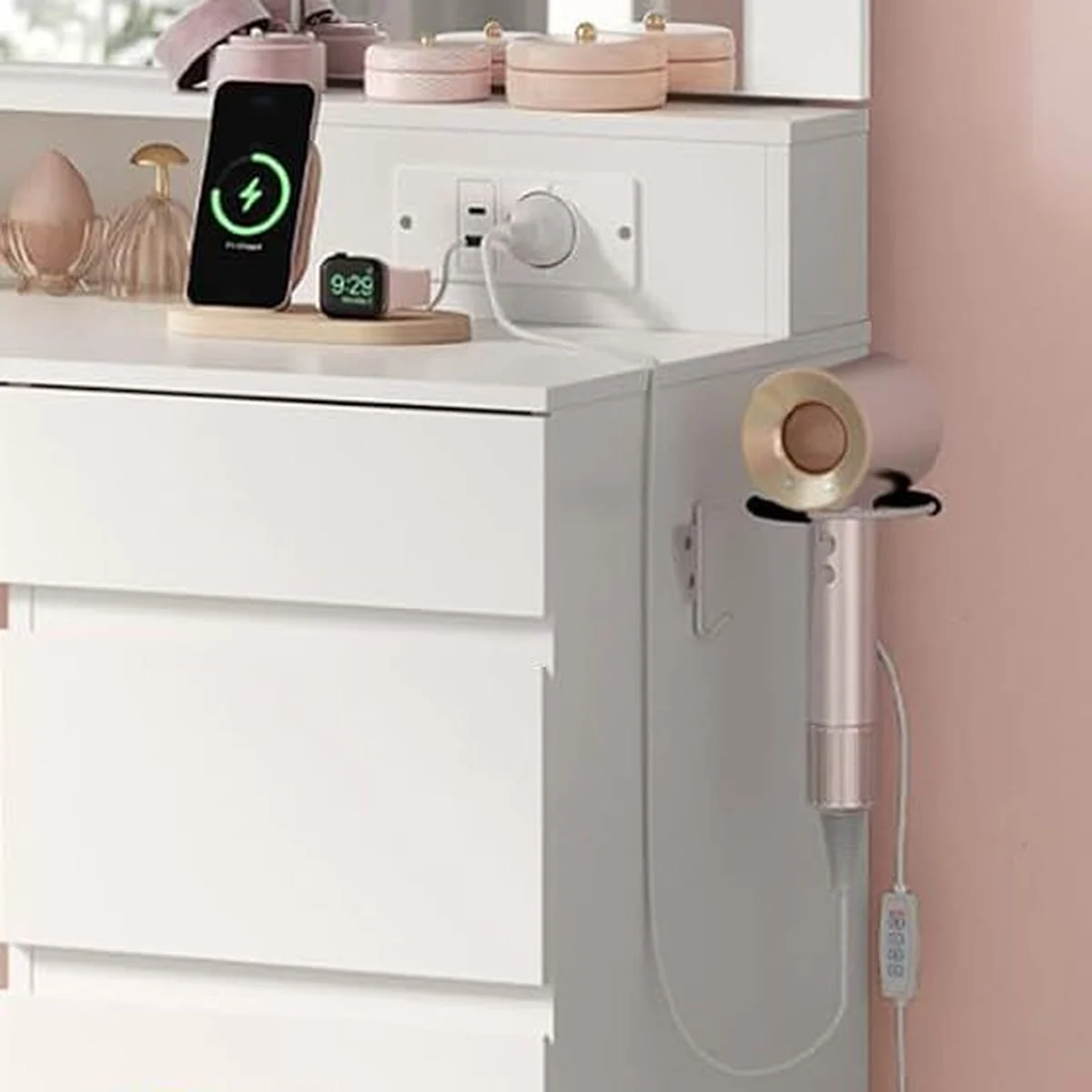 The built-in socket, a phone charging and the hair dryer in its holder