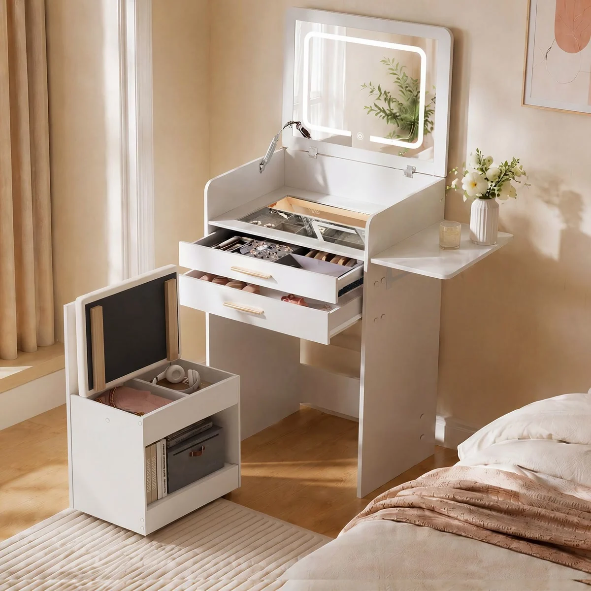 The stool opened to show its storage, and the dressing table’s 2 drawers open